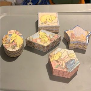 Five decorative Classic Pooh cardboard boxes.
